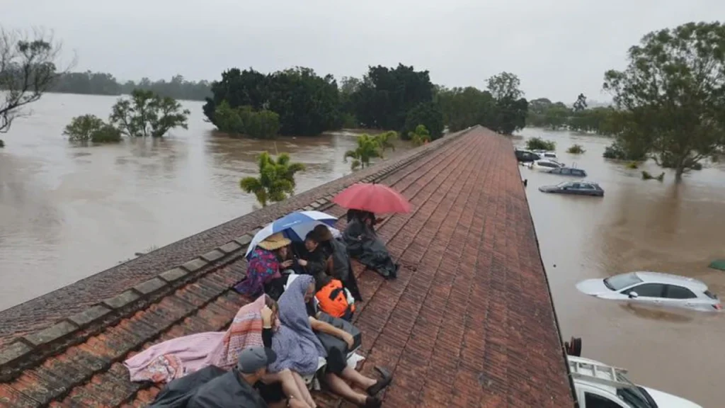 NSW floods: one confirmed dead, fears deepen for three still missing in worsening crisis
