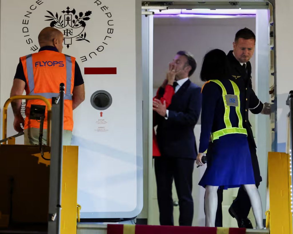 Emmanuel Macron says video of his wife pushing him was just them ‘joking around’